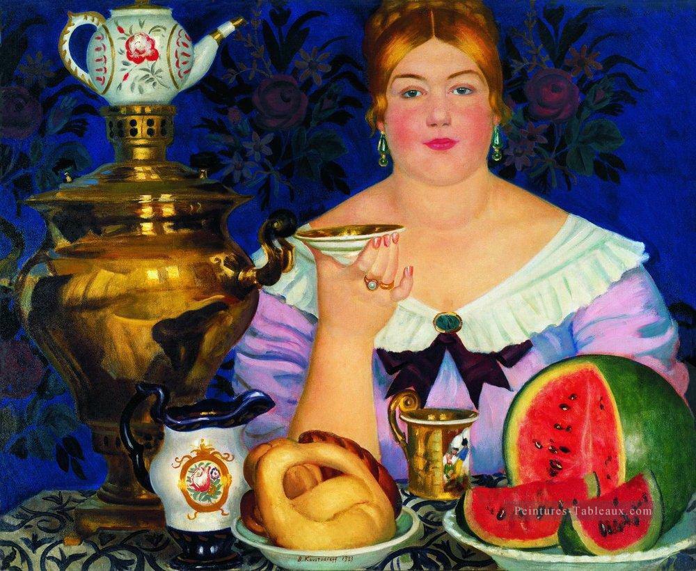 femme de mercahnt buvant du thé 1923 Boris Mikhailovich Kustodiev Peintures à l'huile